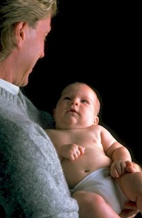 man holding baby